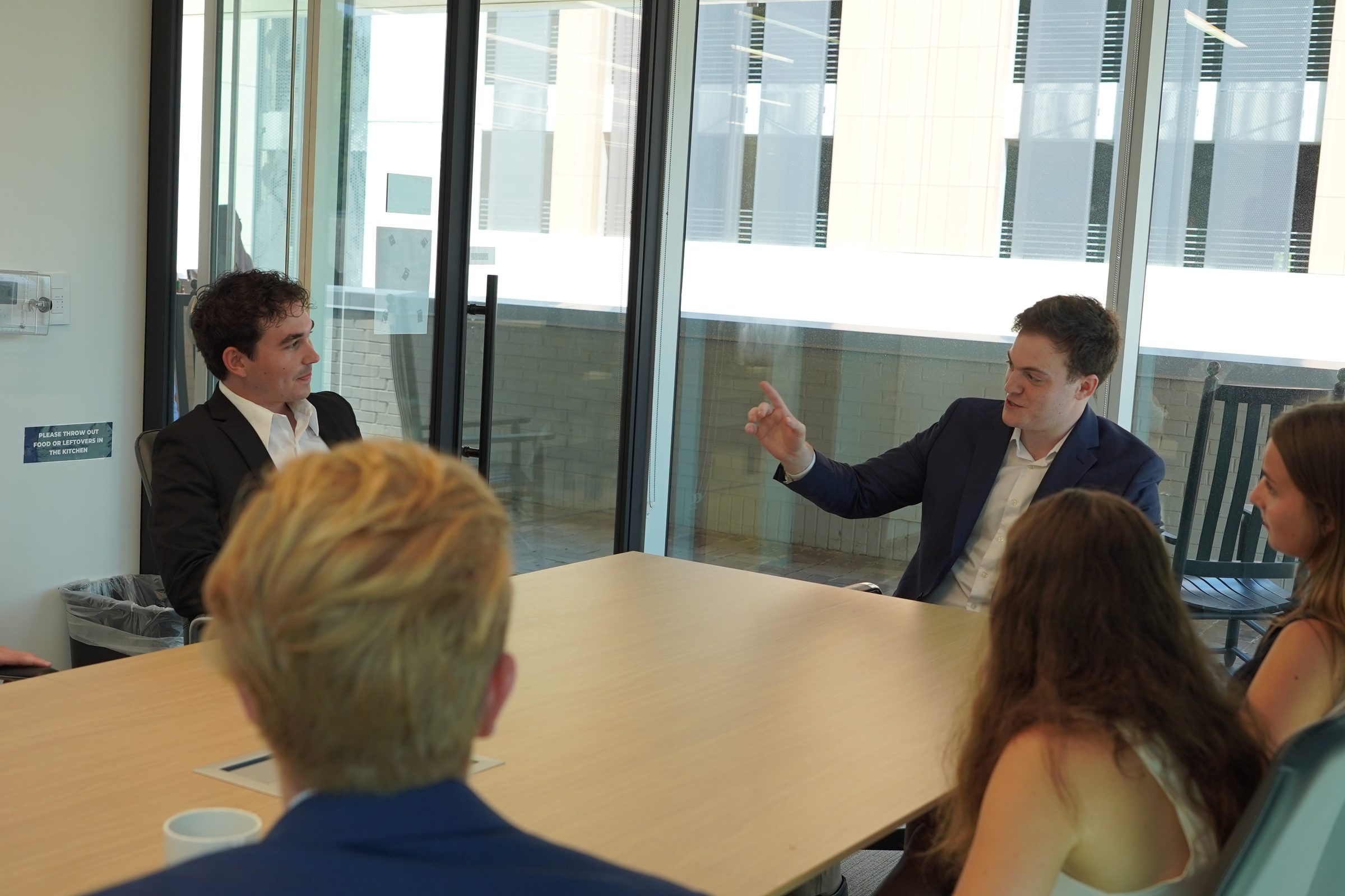 Justin Sonnenreich in conversation with his team in Chapel Hill